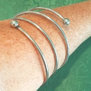 Silver tone spiral arm bracelet